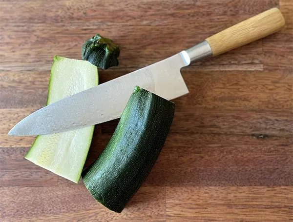 Messermeister Mu chef knife w-zucchini.