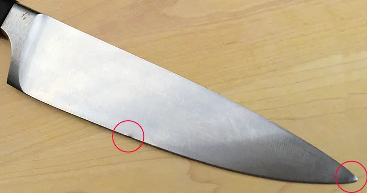 Wusthof Gran Prix chef knife before sharpening showing damage